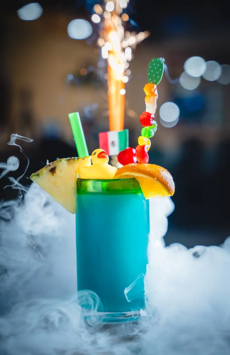Blue cocktail with a sparkler